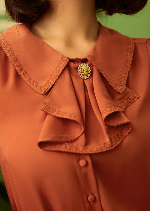 Blus med volangmönster-1